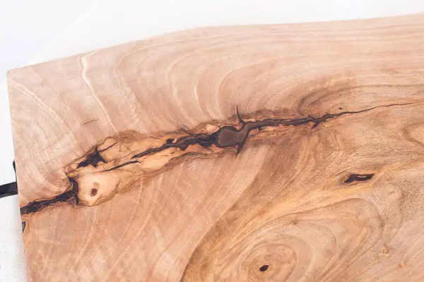 stock image Wooden kitchen board. Working board made of walnut wood with epoxy resin. Food tray