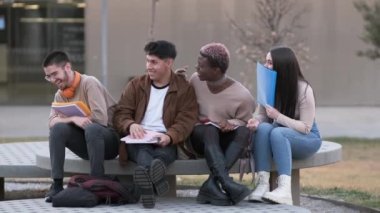 Slow motion video of a transgender person with a multicultural group of friends enjoying while chatting together in the university