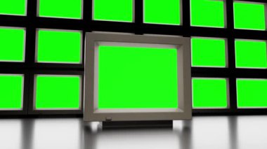 Real time zoom in low angle ground level of many vintage televisions with green screen on each other against black background