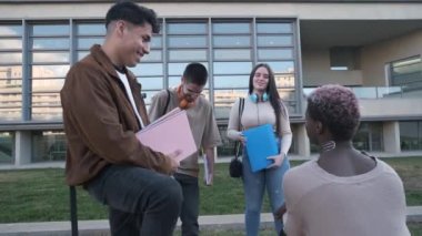 Slow motion video of a multiethnic group of students in a circle talking outside the university