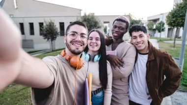 Stop motion group of cheerful multiracial students making faces and taking selfie after university studies