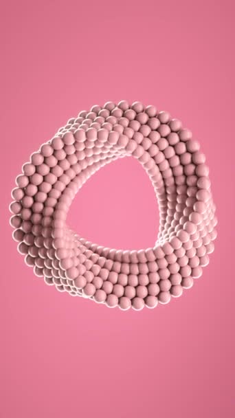 三维循环动画的小球模塑成粉红色的不均匀圆形 中间的孔不停地旋转 在粉色背景下放松和释放应力 纵向背景 — 图库视频影像