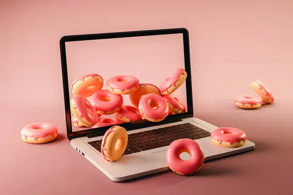 From above 3d rendering of laptop with pink halves of fresh doughnuts placed on placed around opened notebook against pink surface