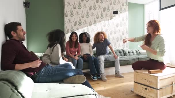 Slow Motion Young Multiethnic Friends Sitting Sofas Playing Charades Spending — Stock Video