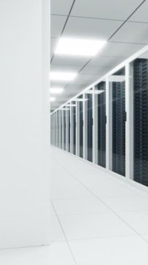 Modern light server room with long corridor between server racks locked behind glass doors
