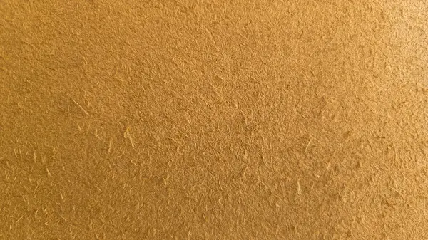 Duvarın arka planı sarı-kahverengi. Dokulu alçı kabuk böceği. Soyut kahverengi arkaplan dokusu duvarı