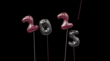Renkli yeni yıl balonu 2024 yazarken 4 'ü uçuyor, 5' i ise 2025 siyah ve kırmızı şeklinde yüzüyor.