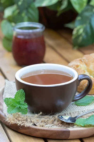Cup Tea Mint Leaves Croissant Jar Jam Outdoors Wooden Patio — Stock Photo, Image