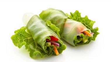 Fresh spring rolls wrapped in crisp lettuce leaves, filled with vibrant, colorful vegetables for a healthy, delicious treat. clipart