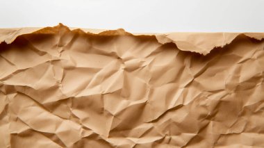 Crumpled brown paper with rugged texture and uneven edges creates a rustic and earthy appearance. clipart