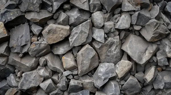 Stock image A pile of rocks with a grayish color. The rocks are scattered and piled up in various sizes. Concept of ruggedness and roughness, as if it were a natural landscape or a construction site