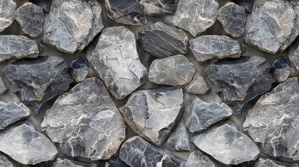 stock image Close-up of rough, gray stones stacked together, creating a natural, textured surface.