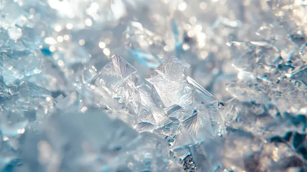 stock image Close-up of shiny ice crystals reflecting light, creating a cold and sparkling texture.