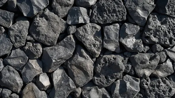 stock image Jagged gray stones arranged into a sharp, textured surface.