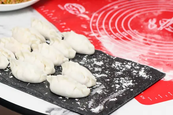 cooking traditional chinese transparent dumplings in the kitchen 74
