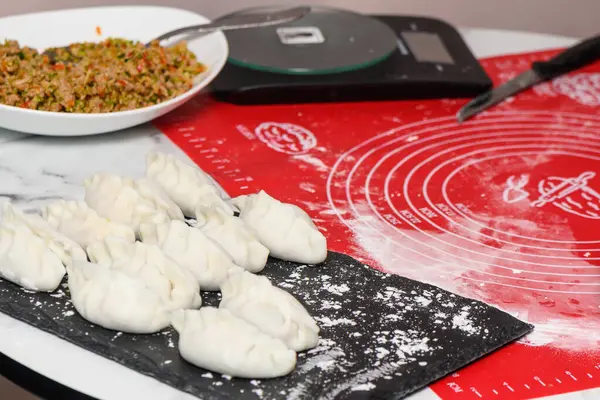 cooking traditional chinese transparent dumplings in the kitchen 76