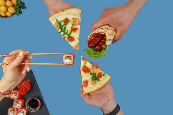 hands hold a slice of pizza, hands hold a roll, hands hold a shawarma