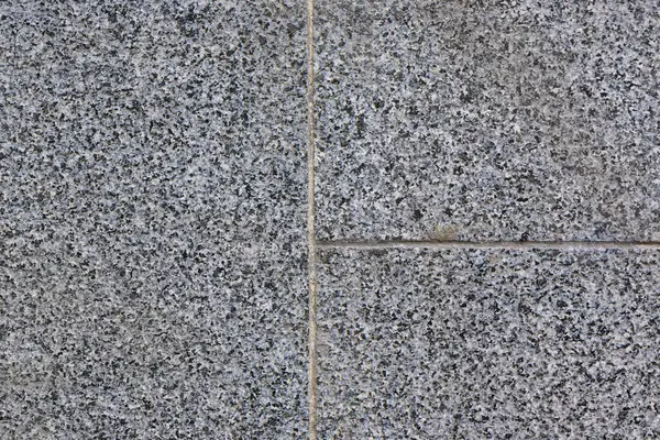 wall lined with granite slabs as a background 2