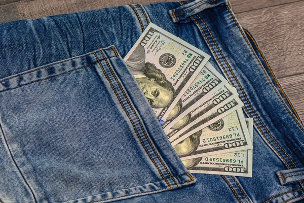 100 dollar pocket money, in jeans pocket, 100 dollar bills 3
