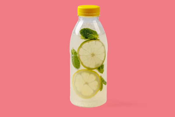 Mojito lemonade with lemon, lime, mint, mojito syrup, ice, sparkling water on red background for food delivery website