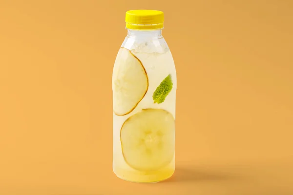 Duchess lemonade with pear, mint, pear syrup, ice, sparkling water on yellow background for food delivery website