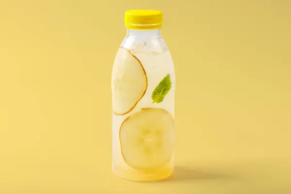 Duchess lemonade with pear, mint, pear syrup, ice, sparkling water on yellow background for food delivery website 1