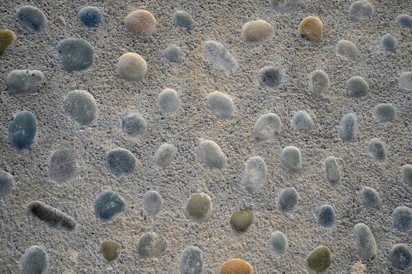 sea pebbles on the sand of the beach