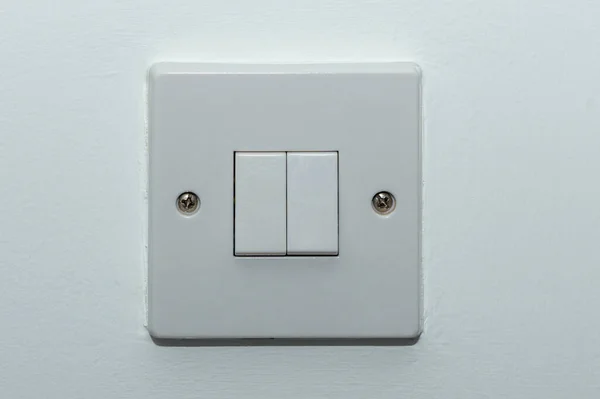 two button switch on a white wall