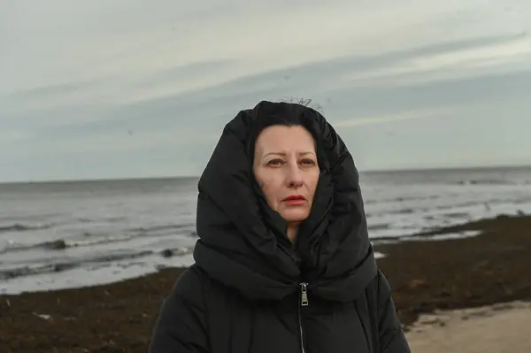 portrait of a woman on the shore of the Baltic sea in winter