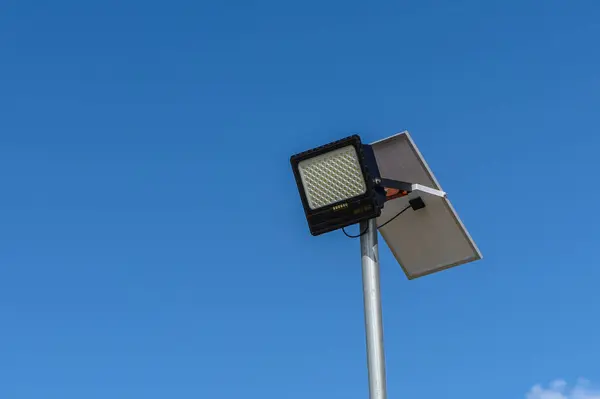 solar-powered street lighting floodlight against the sky 1