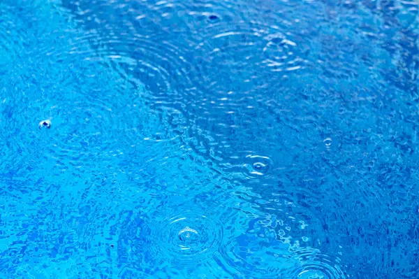 drops of water on the surface of the water in the pool 6