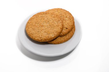 Stack of sweetmeal digestive biscuits isolated on white. clipart