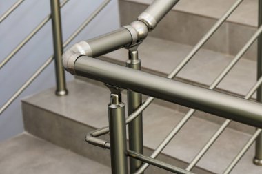 This elegant metal railing complements a chic staircase, featuring a minimalist design that enhances the modern aesthetic of the space while ensuring safety. clipart