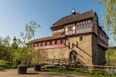 Front view of Hagenwil Castle, a moated castle near Amriswil in the Canton of Thurgau, Switzerland. It was built at the beginning of the 13th century. clipart