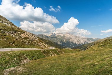 Spluegen pass road from Spluegen towards the top of the  mountain pass, Canton of Grisons, Switzerland clipart