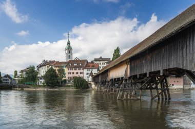 Aare river and old town of Olten with historic wooden bridge, Canton of Solothurn, Switzerland clipart