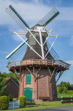 Traditional windmill in East Frisia, Schweindorf, Wittmund district, Lower Saxony, Germany clipart