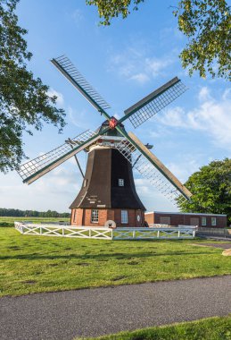 Typical windmill in East Frisia, Grossheide, Aurich district, East Frisia, Lower Saxony, Germany clipart