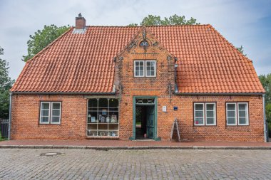 Tetenbuell, Schleswig-Holstein, Germany - September 6, 2018. Haus Peters, a traditional grocery store from the 19th century on Eiderstedt peninsula in North Frisia clipart