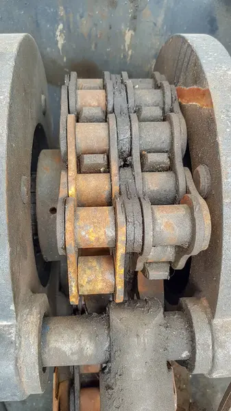 Vertical view of sprocket of rotary motor with chain