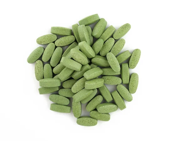 Зелені Овальні Таблетки Білому Тлі Таблетки Великої Спіруліни Харчова Добавка Стокове Зображення