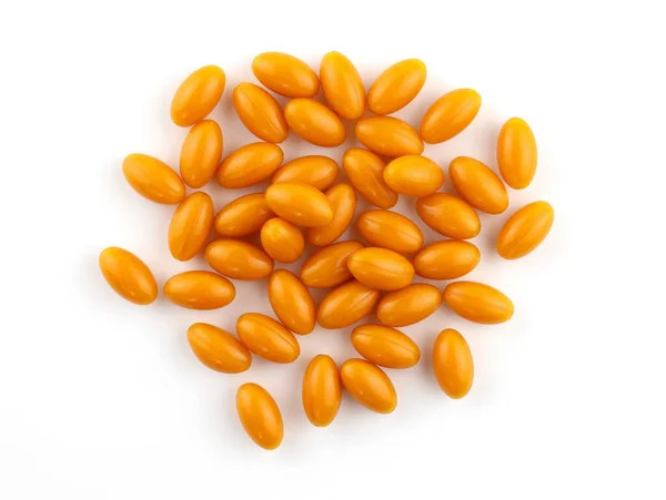白い背景に楕円形のオレンジ色のカプセル ゼラチンシェルQ10トップビューのカプセル 脳活動のための食品サプリメント ビタミンと楕円形のカプセル — ストック写真
