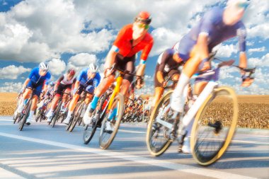 Group of Cyclists During a Race sunlit, motion blur, overcast sky in the background