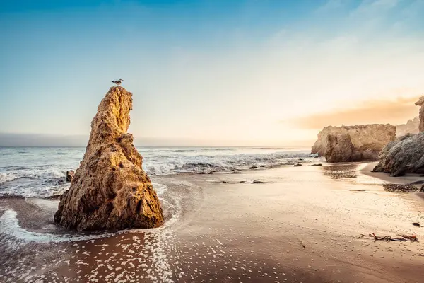 the famous el matador beach during sunset, california