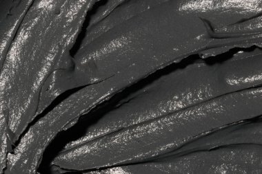 Dead sea mud gray texture background. Cosmetic texture clay mask for face and body. Natural spa cosmetics.