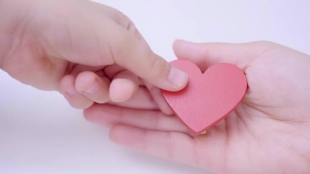 Close Child Hand Giving His Mother Red Heart White Pastel — Vídeos de Stock