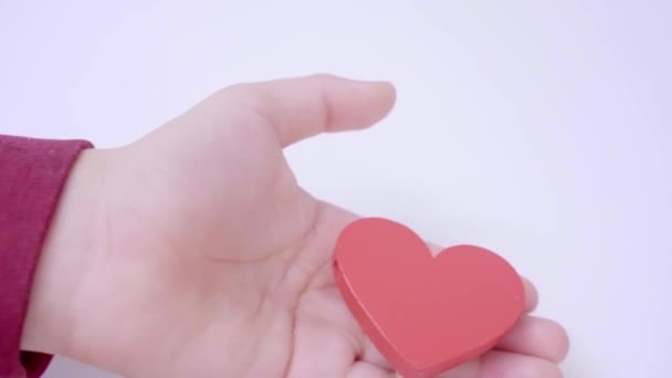 Close Child Hand Giving His Mother Red Heart White Pastel — Stock Video