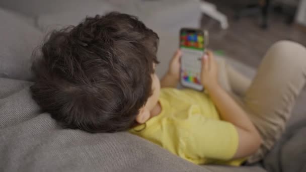 Top View Cute Little Toddler Enjoy Using Modern Gadget Smarphone — стоковое видео