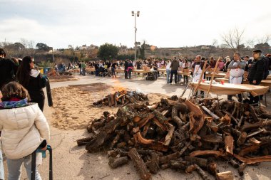 Rustic Calotada BBQ with Friends. Grilled Calots at Catalan Festival in Valls, Spain 26.01.2025 clipart