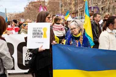 Europeans and other nationalities with Ukrainians came out in support of the rally of Ukraine with national symbols. Three years of russia's war with ukraine. Spain Barcelona 23.02.2035 clipart